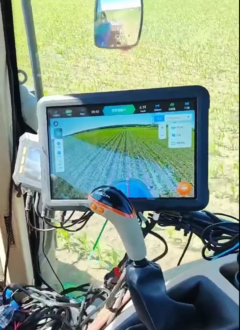 Pds Display Mounted In A Tractor Cabin, Showing Guidance Software Over A Real Field View Through The Windshield